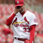 St. Louis Cardinals starting pitcher Kwang Hyun Kim (33) Wipes his eyes in the first inning of a baseball game against the Arizona Diamondbacks, Wednesday, June 30, 2021, in St. Louis. (AP Photo/Tom Gannam)