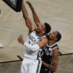 Milwaukee Bucks' Giannis Antetokounmpo, left, drives past Brooklyn Nets' Kevin Durant (7) during the second half of Game 7 of a second-round NBA basketball playoff series Saturday, June 19, 2021, in New York. (AP Photo/Frank Franklin II)