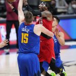 Portland Trail Blazers forward Robert Covington (23) shoots against Denver Nuggets center Nikola Jokic (15) during the second half of Game 5 of a first-round NBA basketball playoff series Tuesday, June 1, 2021, in Denver. (AP Photo/Jack Dempsey)