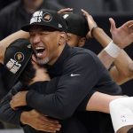 Phoenix Suns head coach Monty Williams, right, hugs Dario Saric after they won Game 6 of the NBA basketball Western Conference Finals against the Los Angeles Clippers Wednesday, June 30, 2021, in Los Angeles. The Suns won the game 130-103 to take the series 4-2. (AP Photo/Mark J. Terrill)