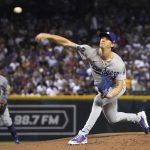 Los Angeles Dodgers pitcher Walker Buehler throws against the Arizona Diamondbacks in the first inning during a baseball game, Saturday, June 19, 2021, in Phoenix. (AP Photo/Rick Scuteri)