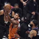 Phoenix Suns guard Cameron Payne, left, shoots as Los Angeles Clippers guard Reggie Jackson, second from right, and forward Marcus Morris Sr. defend during the first half in Game 6 of the NBA basketball Western Conference Finals Wednesday, June 30, 2021, in Los Angeles. (AP Photo/Mark J. Terrill)