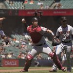 Arizona Diamondbacks catcher Carson Kelly, center, throws out San Francisco Giants' Kevin Gausman (not shown) at first base after a sacrifice bunt in the fourth inning of a baseball game Thursday, June 17, 2021, in San Francisco. Diamondbacks relief pitcher Riley Smith, left, and first baseman Christian Walker, right, look on. (AP Photo/Eric Risberg)