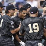 
              Vanderbilt's Jayson Gonzalez, center, celebrates with teammates as he returns to the dugout after hitting a two-run home run against Arizona in the fifth inning during a baseball game in the College World Series, Saturday, June 19, 2021, at TD Ameritrade Park in Omaha, Neb. (AP Photo/Rebecca S. Gratz)
            