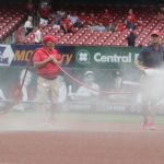 St. Louis Cardinals heads groundskeeper Bill Findley, right, and his crew wet down the infield prior to a baseball game against the Arizona Diamondbacks, Wednesday, June 30, 2021, in St. Louis. (AP Photo/Tom Gannam)