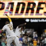 San Diego Padres shortstop Fernando Tatis Jr., left, and center fielder Trent Grisham celebrate after the Padres defeated the Arizona Diamondbacks 11-5 in a baseball game Friday, June 25, 2021, in San Diego. (AP Photo/Gregory Bull)