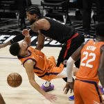 Los Angeles Clippers guard Paul George, top, fouls Phoenix Suns' Devin Booker during the second half in Game 6 of the NBA basketball Western Conference Finals Wednesday, June 30, 2021, in Los Angeles. (AP Photo/Jae C. Hong)