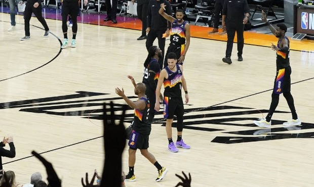 The Phoenix Suns celebrate during the second half of Game 1 of an NBA basketball second-round playo...
