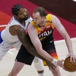 Los Angeles Clippers guard Paul George, left, guards Utah Jazz guard Joe Ingles during the first half of Game 1 of a second-round NBA basketball playoff series Tuesday, June 8, 2021, in Salt Lake City. (AP Photo/Rick Bowmer)