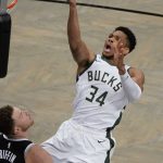 Milwaukee Bucks' Giannis Antetokounmpo (34) shoots over Brooklyn Nets' Blake Griffin (2) during the second half of Game 7 of a second-round NBA basketball playoff series Saturday, June 19, 2021, in New York. (AP Photo/Frank Franklin II)