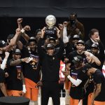 Phoenix Suns head coach Monty Williams, center, hoists the trophy as he and his players celebrate after defeating the Los Angeles Clippers in Game 6 of the NBA basketball Western Conference Finals Wednesday, June 30, 2021, in Los Angeles. (AP Photo/Jae C. Hong)