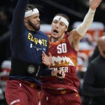 Denver Nuggets forward Aaron Gordon, right, celebrates after scoring a basket with center JaVale McGee in the first half of Game 4 of an NBA second-round playoff series against the Phoenix Suns Sunday, June 13, 2021, in Denver. (AP Photo/David Zalubowski)