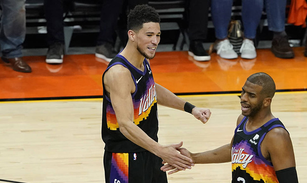 Phoenix Suns guard Devin Booker (1) and guard Chris Paul celebrate during the first half of Game 5 ...