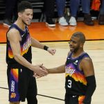 
              Phoenix Suns guard Devin Booker (1) and guard Chris Paul celebrate during the first half of Game 5 of an NBA basketball first-round playoff series against the Los Angeles Lakers, Tuesday, June 1, 2021, in Phoenix. (AP Photo/Matt York)
            
