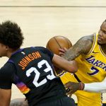Los Angeles Lakers guard Ben McLemore (7) fouls Phoenix Suns forward Cameron Johnson (23) during the second half of Game 5 of an NBA basketball first-round playoff series, Tuesday, June 1, 2021, in Phoenix. (AP Photo/Matt York)