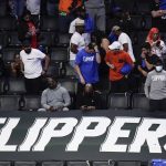 Fans react after the Los Angeles Clippers' 130-103 loss to the Phoenix Suns in Game 6 of the NBA basketball Western Conference Finals Wednesday, June 30, 2021, in Los Angeles. (AP Photo/Jae C. Hong)