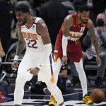 Phoenix Suns center Deandre Ayton reacts after dunking the ball in the second half of Game 4 of an NBA second-round playoff series against the Denver Nuggets, Sunday, June 13, 2021, in Denver. Phoenix won 125-118 to sweep the series. (AP Photo/David Zalubowski)