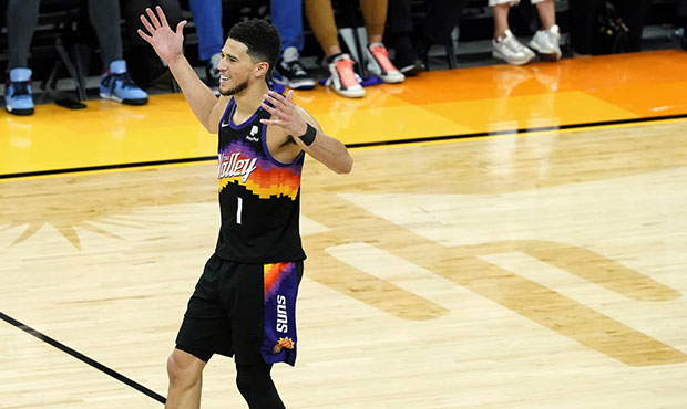 Phoenix Suns guard Devin Booker (1) celebrates during the second half of Game 2 of an NBA basketbal...