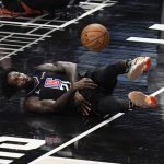 Los Angeles Clippers' Patrick Beverley dives in an unsuccessful attempt to retrieve a loose ball during the first half in Game 6 of the NBA basketball Western Conference Finals against the Phoenix Suns Wednesday, June 30, 2021, in Los Angeles. (AP Photo/Jae C. Hong)