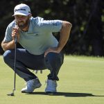 Dustin Johnson lines up his putt on the 11th green during the first round of the Travelers Championship golf tournament at TPC River Highlands, Thursday, June 24, 2021, in Cromwell, Conn. (AP Photo/John Minchillo)