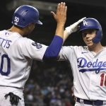 Los Angeles Dodgers' Will Smith, right, celebrates with Mookie Betts (50) after hitting a two run home run against the Arizona Diamondbacks in the first inning during a baseball game, Saturday, June 19, 2021, in Phoenix. (AP Photo/Rick Scuteri)