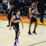 Phoenix Suns guard Devin Booker (1) and guard Cameron Payne (15) celebrate a three pointer during Game 1 of an NBA basketball second-round playoff series against the Denver Nuggets, Monday, June 7, 2021, in Phoenix. (AP Photo/Matt York)