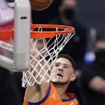 Phoenix Suns guard Devin Booker dunks during the first half in Game 6 of the NBA basketball Western Conference Finals against the Los Angeles Clippers Wednesday, June 30, 2021, in Los Angeles. (AP Photo/Mark J. Terrill)