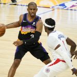 Phoenix Suns guard Chris Paul looks to pass as Los Angeles Clippers guard Reggie Jackson, right, defends during the first half of game 5 of the NBA basketball Western Conference Finals, Monday, June 28, 2021, in Phoenix. (AP Photo/Matt York)