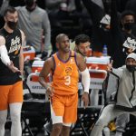 Phoenix Suns on the bench react after guard Chris Paul (3) hit a basket late in the second half of Game 3 of an NBA second-round playoff series against the Denver Nuggets on Friday, June 11, 2021, in Denver. Phoenix won 116-102. (AP Photo/David Zalubowski)