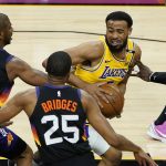 Los Angeles Lakers guard Talen Horton-Tucker is pressured by Phoenix Suns forward Mikal Bridges (25) and guard Chris Paul (3) during the first half of Game 5 of an NBA basketball first-round playoff series, Tuesday, June 1, 2021, in Phoenix. (AP Photo/Matt York)