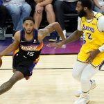 Phoenix Suns guard Cameron Payne (15) drives as Los Angeles Lakers center Andre Drummond (2) defends during the second half of Game 5 of an NBA basketball first-round playoff series, Tuesday, June 1, 2021, in Phoenix. (AP Photo/Matt York)