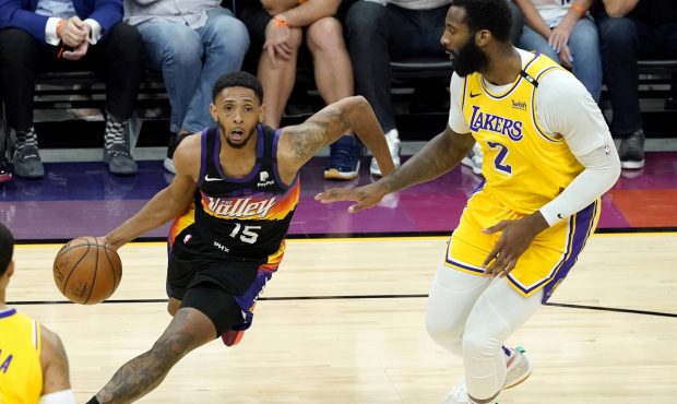 Phoenix Suns guard Cameron Payne (15) drives as Los Angeles Lakers center Andre Drummond (2) defend...