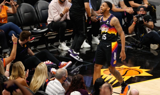 Cameron Payne #15 of the Phoenix Suns reacts to a foul call against the Denver Nuggets during the s...
