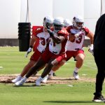 Defensive linemen Michael Dogbe (91), Ryan Bee (96) and David Parry (93) go through drills as defensive coordinator Vance Joseph (left) looks on during Day 2 of Cardinals mandatory minicamp on Wednesday, June 9, 2021, in Tempe. (Tyler Drake/Arizona Sports)