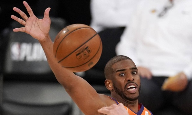 Los Angeles Lakers center Marc Gasol, below, passes the ball as Phoenix Suns guard Chris Paul defen...