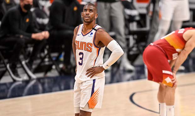 Chris Paul #3 of the Phoenix Suns walks on the court as Facundo Campazzo #7 of the Denver Nuggets p...