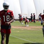 Wide receiver A.J. Green (18) and running back Chase Edmonds (2) warm up during the Cardinals' first day of mandatory minicamp on Tuesday, June 8, 2021, in Tempe. (Tyler Drake/Arizona Sports)