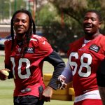 Wide receiver DeAndre Hopkins (10) and offensive lineman Kelvin Beachum (68) get a laugh in during Day 3 of Cardinals minicamp Thursday, June 10, 2021, in Tempe. (Tyler Drake/Arizona Sports)
