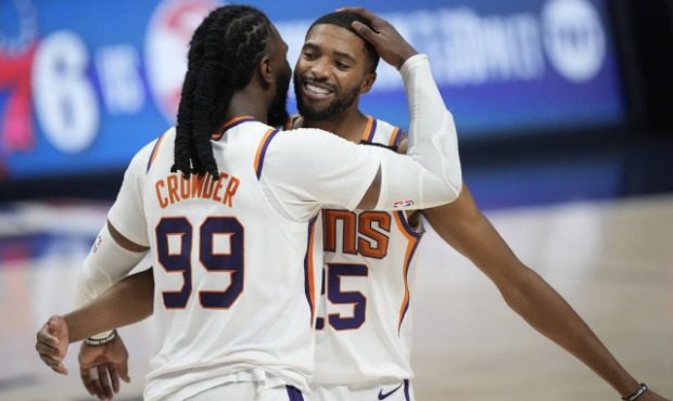 Phoenix Suns forward Jae Crowder, left, hugs forward Mikal Bridges as time runs out in the second h...