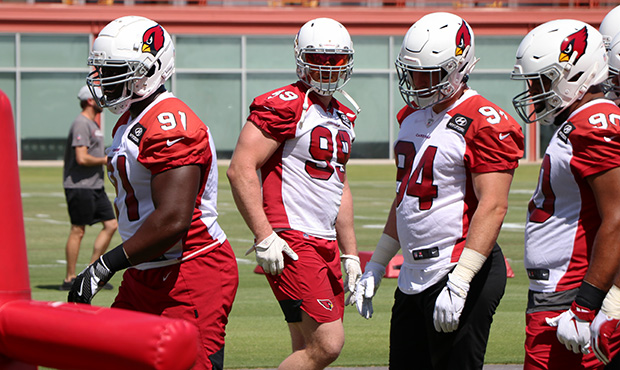 Defensive end J.J. Watt (99) looks on during the Cardinals' first day of mandatory minicamp on Tues...