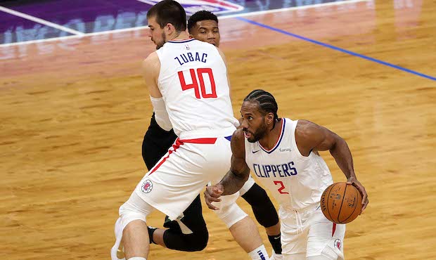 FEBRUARY 28: Kawhi Leonard #2 of the LA Clippers drives around a pick set by Ivica Zubac #40 during...