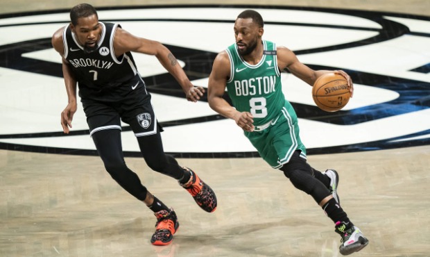 Boston Celtics guard Kemba Walker (8) drives past Brooklyn Nets forward Kevin Durant (7) during the...