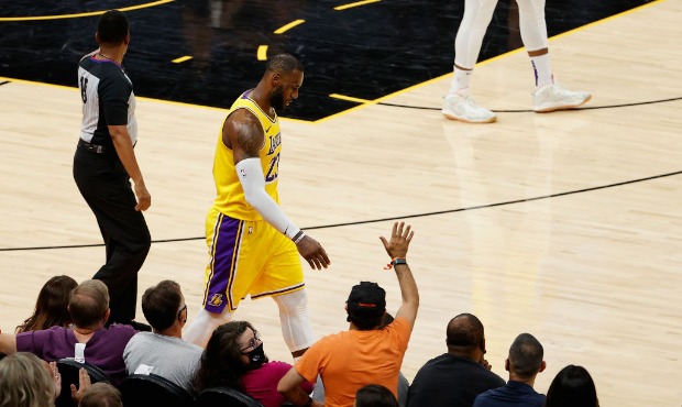 LeBron James #23 of the Los Angeles Lakers reacts as he walks off the court during the second half ...