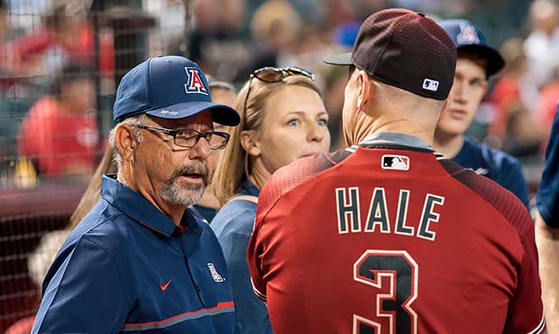 University of Arizona softball head coach Mike Candrea and manager Chip Hale #3 of the Arizona Diam...