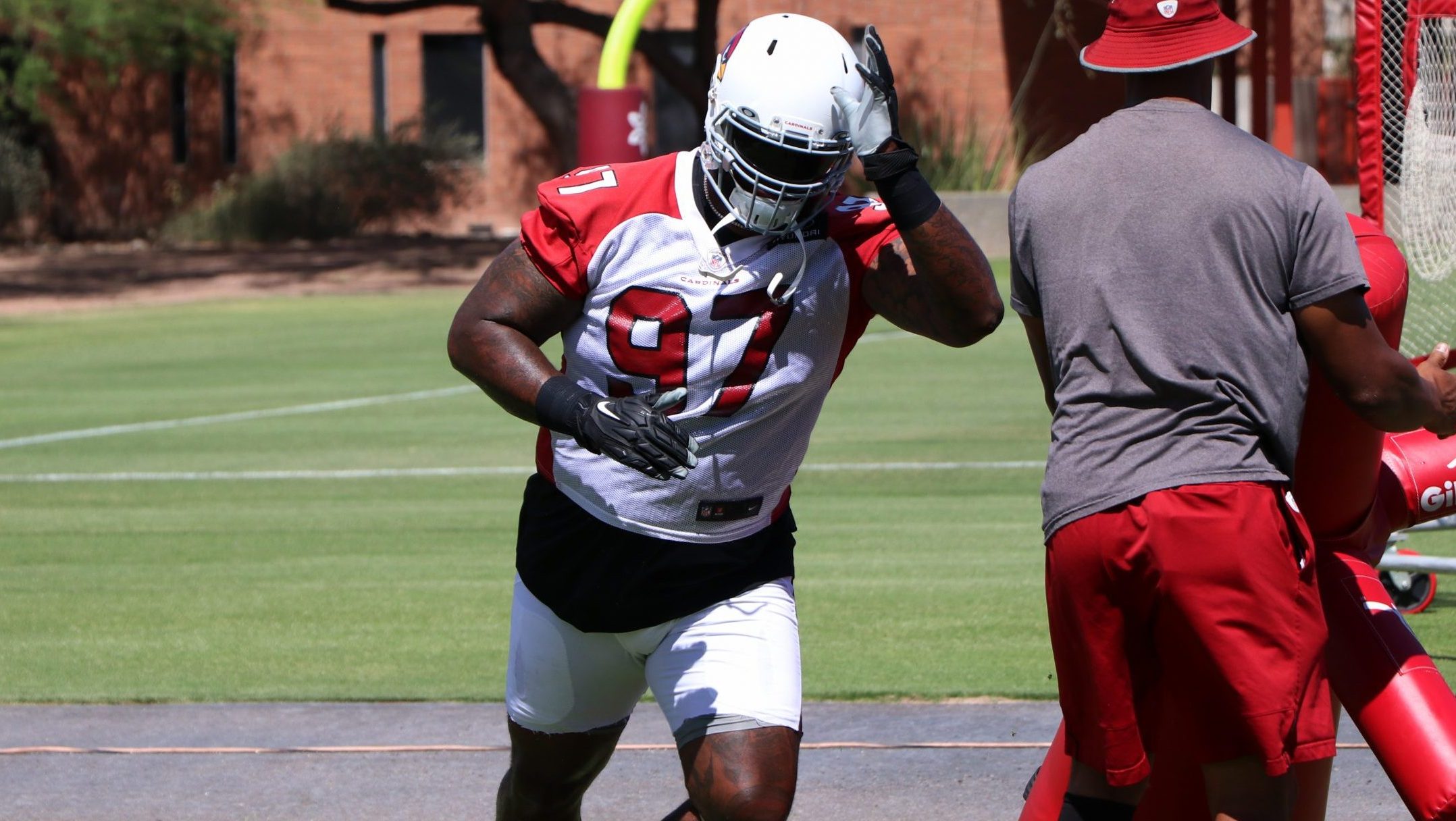 Defensive lineman Jordan Phillips goes through drills during the Cardinals' first day of mandatory ...