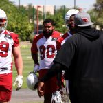 Members of Arizona's defensive line get a lesson from DL coach Brentson Buckner during Day 2 of Cardinals mandatory minicamp on Wednesday, June 9, 2021, in Tempe. (Tyler Drake/Arizona Sports)