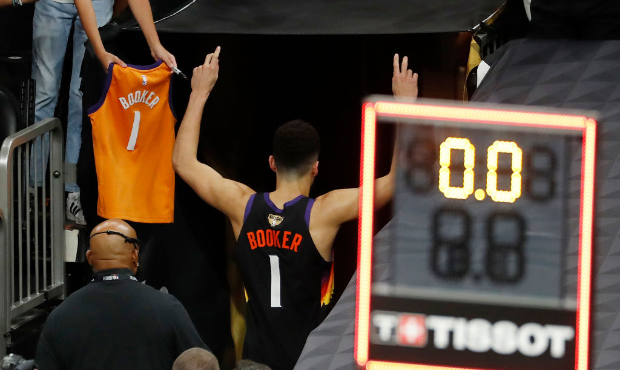 Devin Booker #1 of the Phoenix Suns leaves the court after the team's win against the Milwaukee Buc...