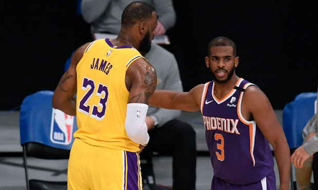 Chris Paul of the Phoenix Suns and LeBron James of the Los Angeles Lakers shake hands after a 114-1...