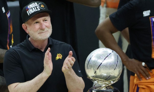 Owner Robert Sarver stands with the Western Conference Championship trophy after the Suns beat the ...