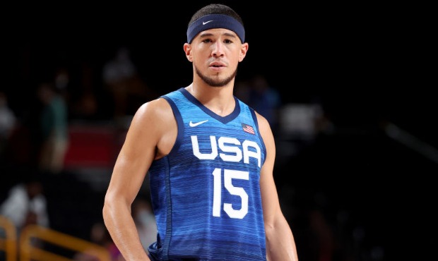 Devin Booker #15 of Team United States looks on during the first half of their Men's Preliminary Ro...